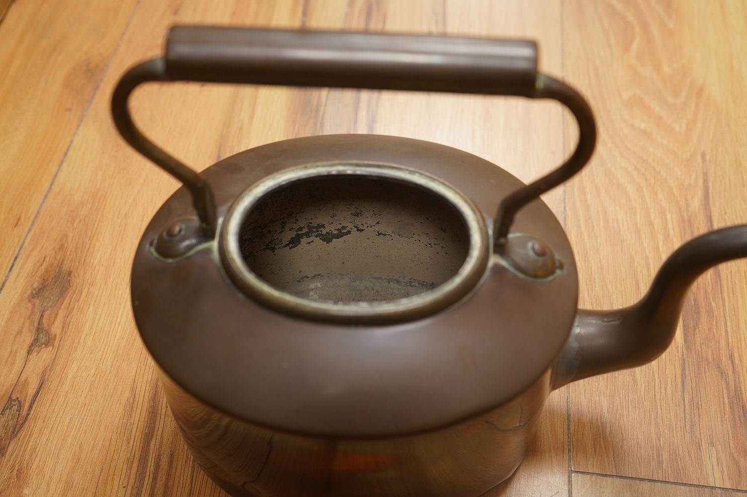 Two Benham & Froud copper saucepans and a copper kettle, largest 43cm in length